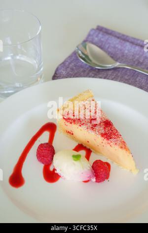 Raspberry cheese cake with ice cream Stock Photo