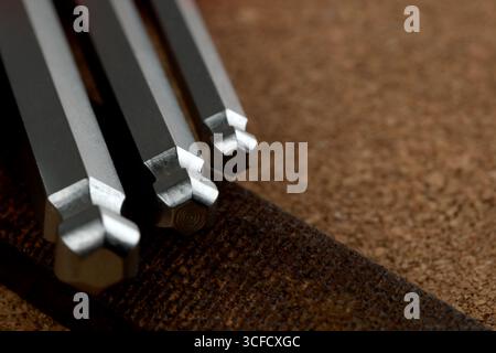 Various metal tools are arranged neatly, showcasing their craftsmanship and design. Stock Photo