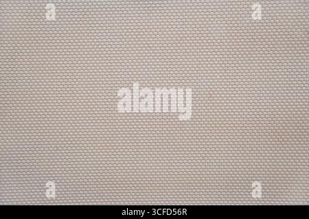 Detail of beige fiber canvas texture with stitch effect from a pool hammock Stock Photo