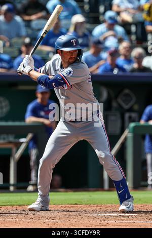 Texas Rangers catcher Kyle Higashioka, center left, tags out San Diego ...