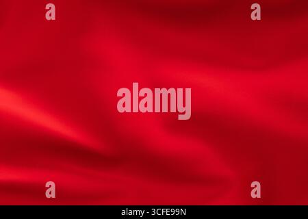 Bright red fabric with soft folds, textile texture close-up Stock Photo