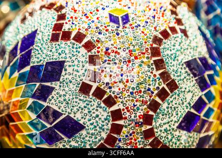 Traditional table lamps with glass bulbs in the form of a multi-colored mosaic. Stock Photo