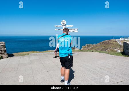 Land's End official photographer taking picture at the sign board Stock Photo