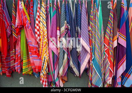 Multicolor Pure cotton Gamucha (Bath Towel) Check Fabrics Close-up. colorful cotton thin towel hanging on a wall for sale. Stock Photo