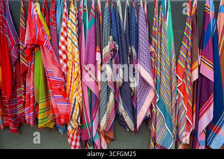 Multicolor Pure cotton Gamucha (Bath Towel) Check Fabrics Close-up. colorful cotton thin towel hanging on a wall for sale. Stock Photo