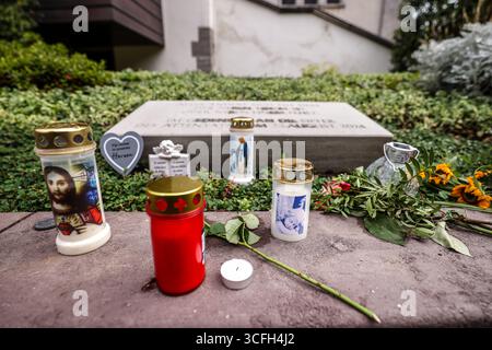 Solingen, Germany. 23rd Aug, 2025. A memorial stone commemorates the victims of the terrorist attack in Solingen on August 23, 2024, candles and flowers are laid in front of it. Credit: Christoph Reichwein/dpa/Alamy Live News Stock Photo