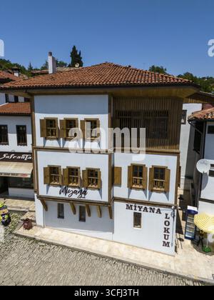 A single historic building with wooden windows and a red roof on a sunny day, aerial view, traditional Ottoman Konak, Safranbolu, UNESCO World Heritag Stock Photo