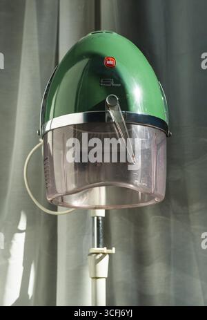 Retro hairdryer by Kadus in the window of a hairdressing salon in sunlight, Wuppertal, Germany, digitally reworked Stock Photo