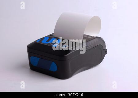 Black receipt printer, mini portable thermal isolated on white background. Stock Photo