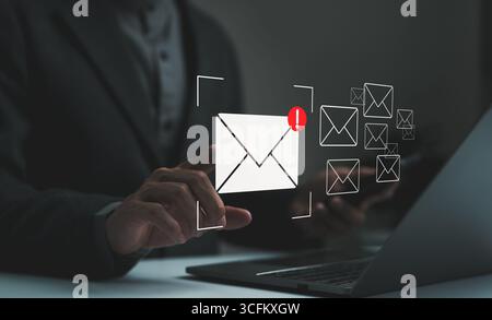 Email spam virus concept. Businessman reading electronic mail with computer. monitor internet security, Cybercrime. Phishing email, Email fraud, Scam Stock Photo