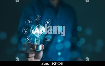 Using AI to help with business and daily life. Businessman holding lightbulb of AI and artificial intelligence automation with digital technology icon Stock Photo