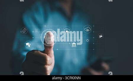 Cyber security concept. Businessman using thumb to scan fingerprint or for digital processing biometric identification to access security system Stock Photo