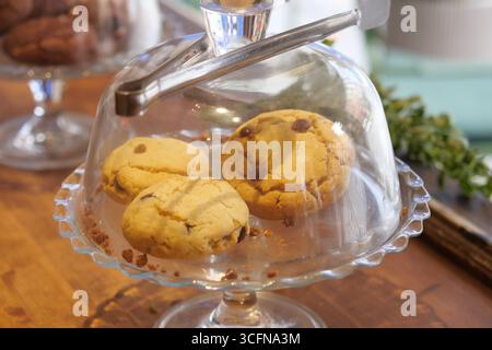 Freshly baked cookies displayed in a charming cafe setting Stock Photo