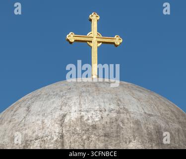 Close-up of the golden cross atop the abandoned Serbian Orthodox Cathedral in Pristina, Kosovo Stock Photo