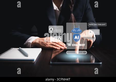 Businesswoman uses chatbot powered by AI technology and artificial intelligence to chat and converse with smart robot system analyzes data to help sol Stock Photo