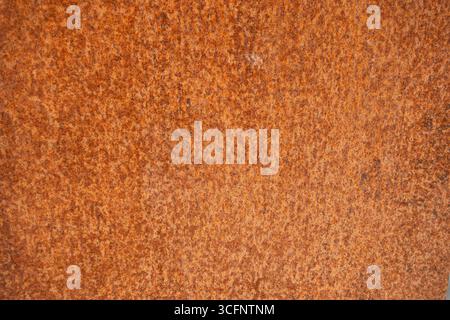 Rusty orange metal surface texture background for industrial or grunge design use Stock Photo