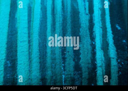 Abstract blue-green vertical lines. Traces of streaks on the boat hull, close-up. Stock Photo
