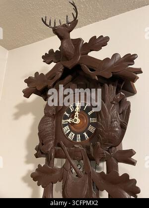 Close-up of a handcrafted cuckoo clock featuring a Majestic stag from West Germany, 1950s Stock Photo