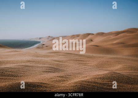 Close up view on sand wavelets blown by the wind Stock Photo