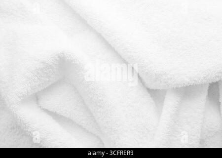 texture of white terry cloth close up. Material for towel, blanket Stock Photo