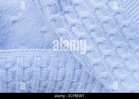 blue knitted baby blanket. baby plaid seamless pattern. pigtail knitting. three types of knitting Stock Photo
