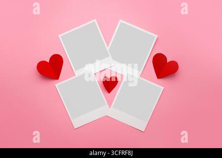 Collage of photo frames with paper hearts isolated on pink background. romantic photo frames. mockup Stock Photo