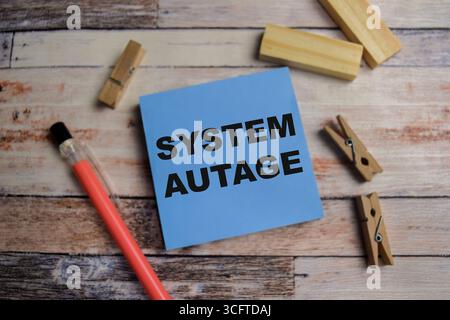 Concept of system autage write on sticky notes isolated on Wooden Table. Stock Photo