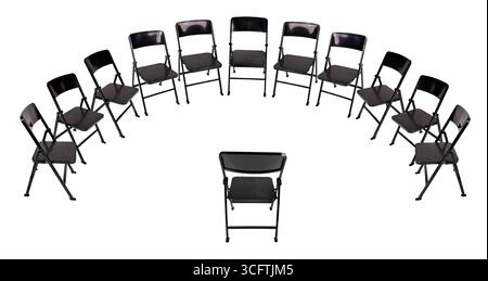 Presentation in front of Black Folding chairs for easy seating for groups set up in a semi-circle Stock Photo