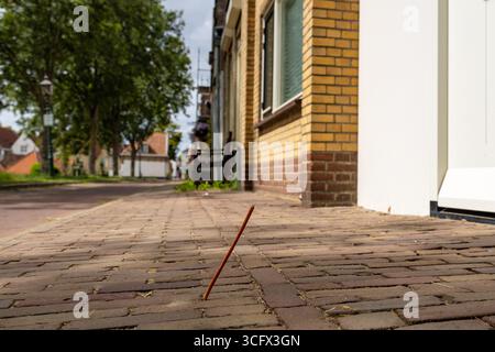 glass fibre optic Internet cable in the ground outside a residential house waiting to be connected to the network for fast internet Stock Photo