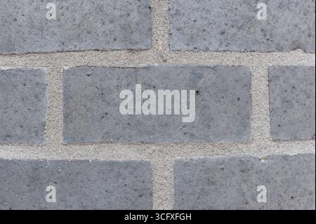 Gray brick wall texture background for interior exterior decoration and industrial construction concept design. Stock Photo