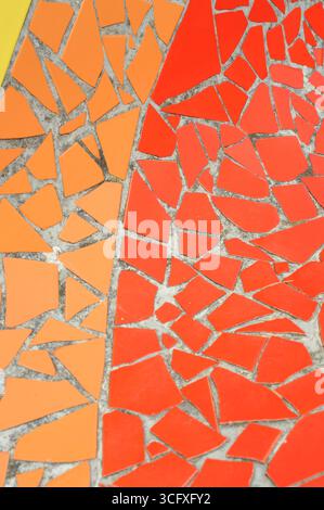 Ceramic tiles mosaic on a wall. Closeup photo of decorative, vintage, artistic tiles creating a geometric pattern. Stock Photo