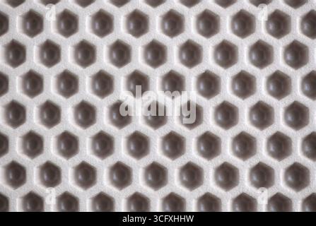 eva ethylene vinyl acetate car mat texture. waterproof carpet with beige honeycomb texture. Stock Photo