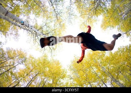 Young man trail running during fall near Fallen Leaf Lake, CA. Stock Photo