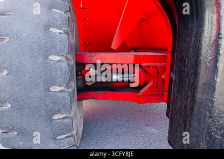 Frontal bulldozer loader. Red excavator close up. Stock Photo