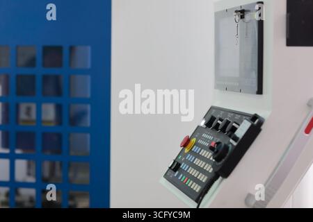 Control console of vertical CNC machining center close up. Selective focus. Stock Photo