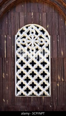Window with decorative grille on church facade in Tijuca neighborhood, Rio de Janeiro, Brazil Stock Photo