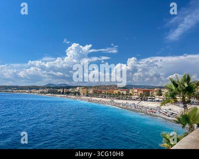 Panorama city of Nice with the Côte d'Azur beach on the French Riviera with blue sea and blue sky with white clouds in summer Stock Photo