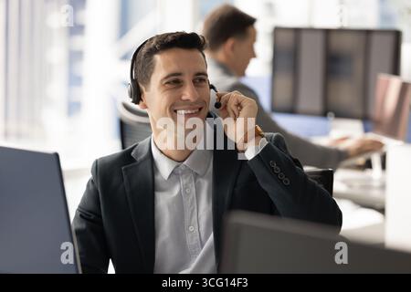Man offering customer support, participating in virtual meeting, assisting client Stock Photo