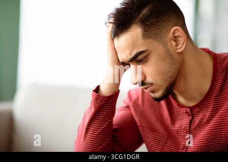 Closeup portrait of upset arab guy having difficulties Stock Photo