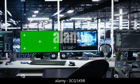 Data center green screen computers showing neural network visualization and code debugging software running. Chroma key PCs in server room powering machine learning and automated research tasks Stock Photo