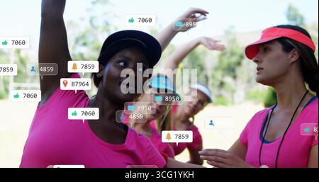 Guiding fitness instructor leading stretching on grassy field with visors and notification icons Stock Photo
