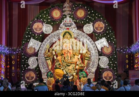 Idol of elephant-headed Hindu god Ganesha adorned with gold and silver ornaments is unveiled at GSB seva mandal in Mumbai. The idol at GSB seva mandal is known as India's richest Ganesha adorned with more than 69 kgs of gold ornaments and more than 336 kgs of silver and other precious items which are usually donated by the devotees. it has also bought an insurance cover of Rs.474.64 crores for the gold and silver ornaments adorning the ganpati idol along with coverage for the volunteers who help in managing and controlling huge number of devotees who come to pray there during the festival. (Ph Stock Photo