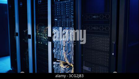 Empty data center, cables and storage in server room for IT, infrastructure and software security. Interior, power supply and wires for electrical Stock Photo