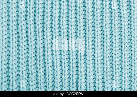 Blue texture of a large knit sweater. Knitted scarf background, winter cozy textile background Stock Photo