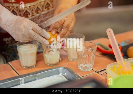 Hard boiled eggs in cup ready to eat from the shop grilled eggs street food of Thailand. Breakfast with soft boiled egg. Stock Photo