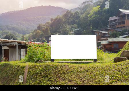 Empty wooden sign with copy space for text setting in rural village high in the mountains. Copy space. Stock Photo
