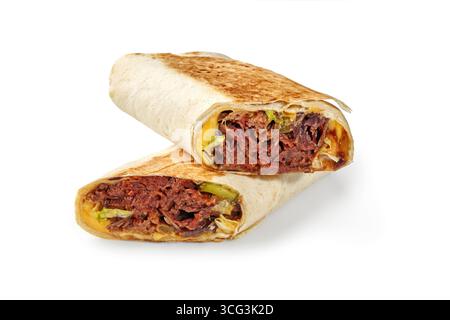 Two halves of delicious juicy shawarma sandwich with beef, pickles and cheddar cheese lying on top of each other Stock Photo