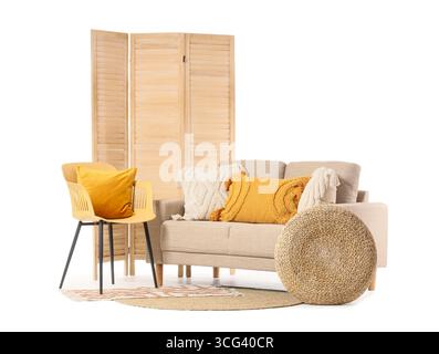 Modern beige sofa, folding screen and pouf isolated on white background Stock Photo