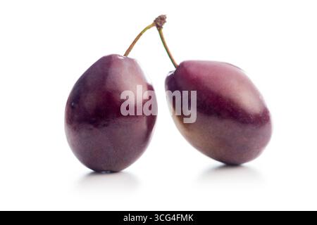 Ripe plums isolated on a white background. Stock Photo