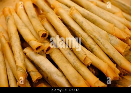 crispy, golden-brown fried spring rolls stacked, traditional Chinese food Stock Photo